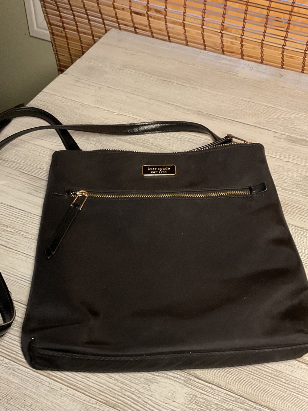 kate spade black crossbody with gold hardware